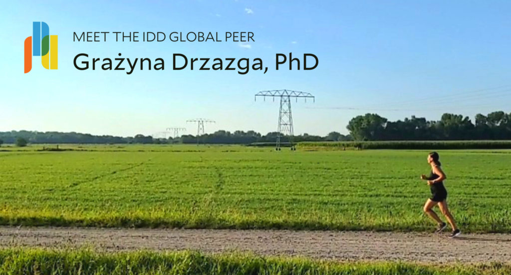 Grażyna Drzazga running with green grass and blue sky