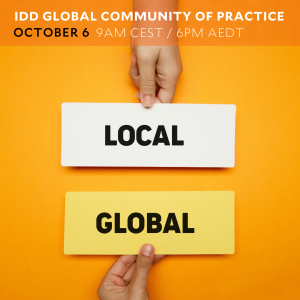 hand holding 'local' sign and hand holding 'global' sign