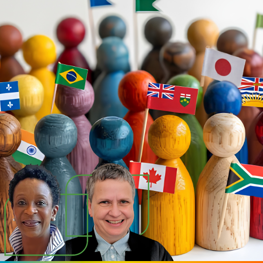 colorful wooden figures holding national and local flags + Karen Francis & Alison Cummings